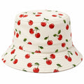 Cappello a Secchiello con Motivo Ciliegie Rosse su Sfondo Panna
